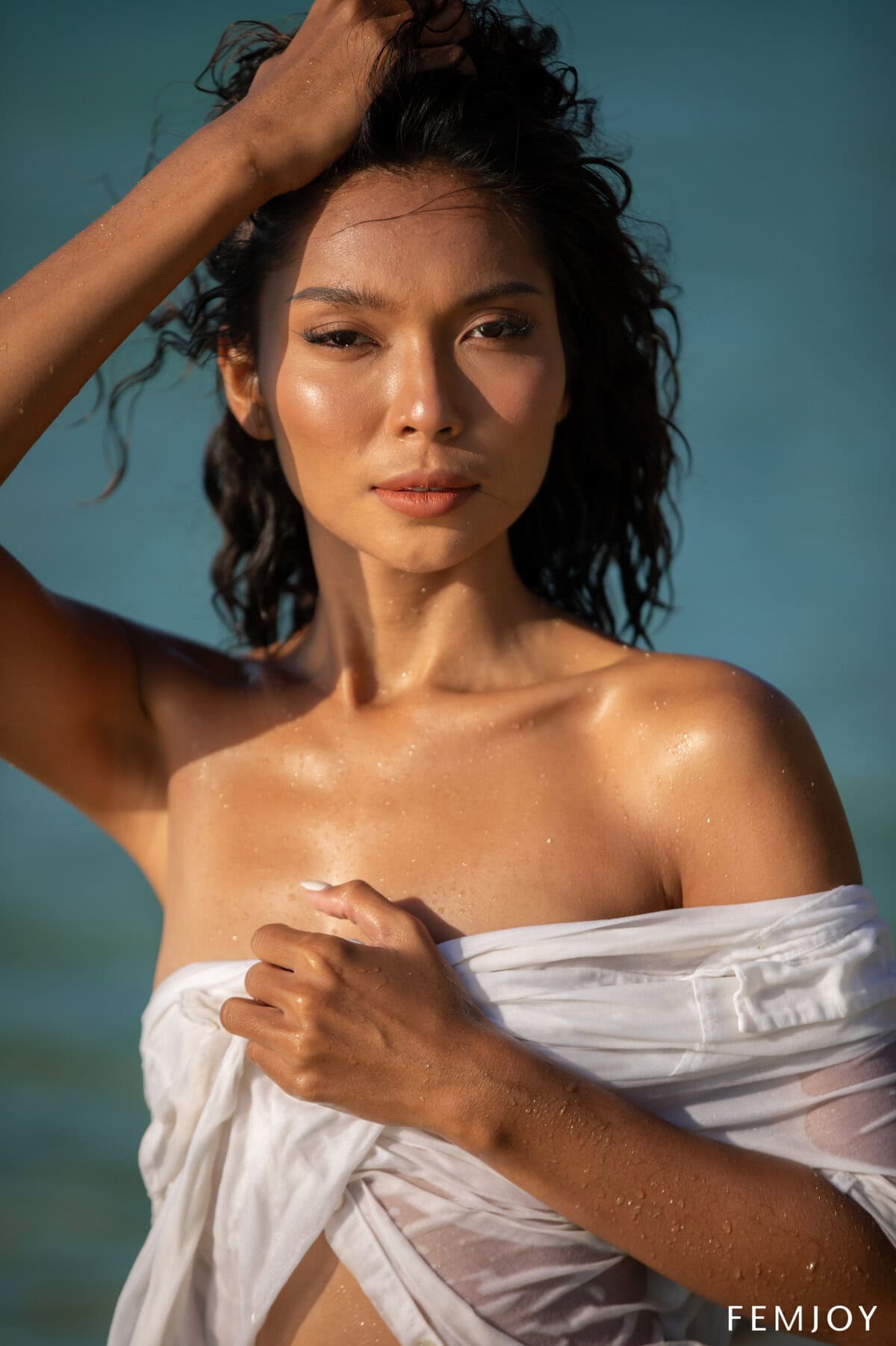 Rose drops her shirt and panties at the beach, showing off her flat-chested body