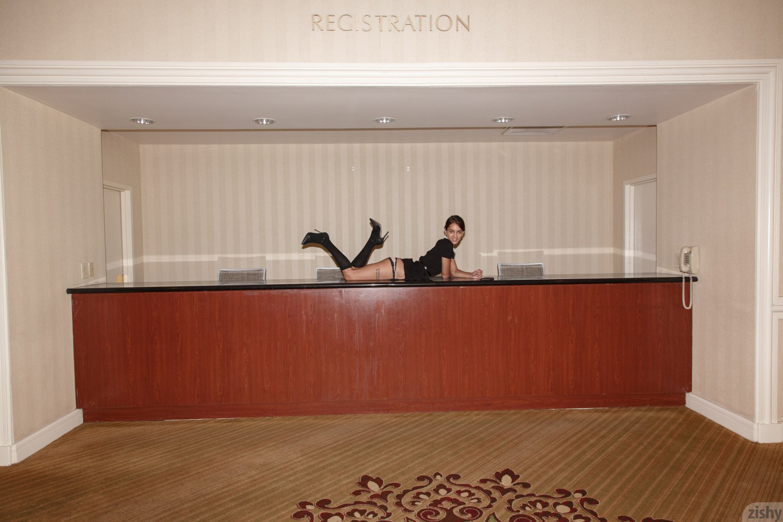 Uma Jolie getting naughty on the registration desk