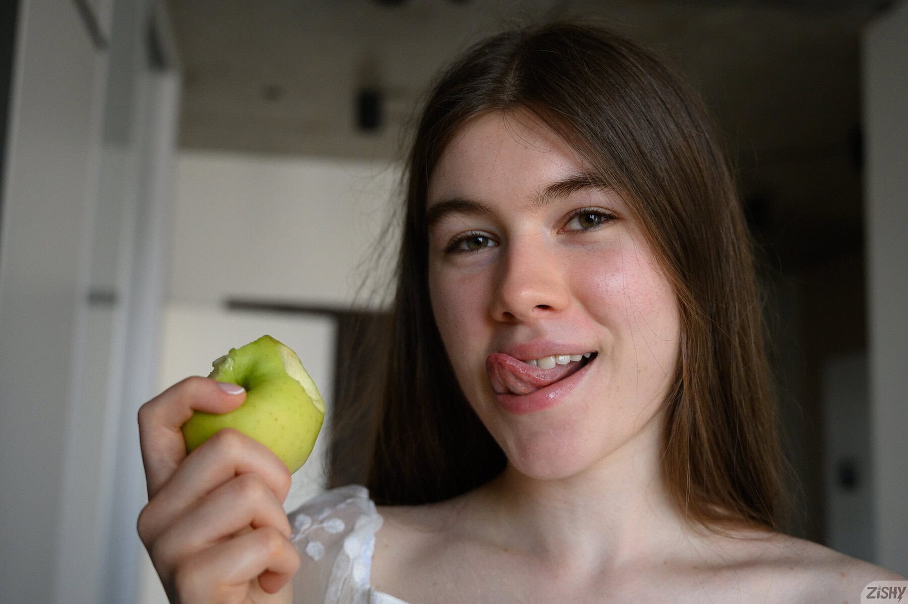 Yvain Cormich strips on the couch, revealing her big boobs and natural curves