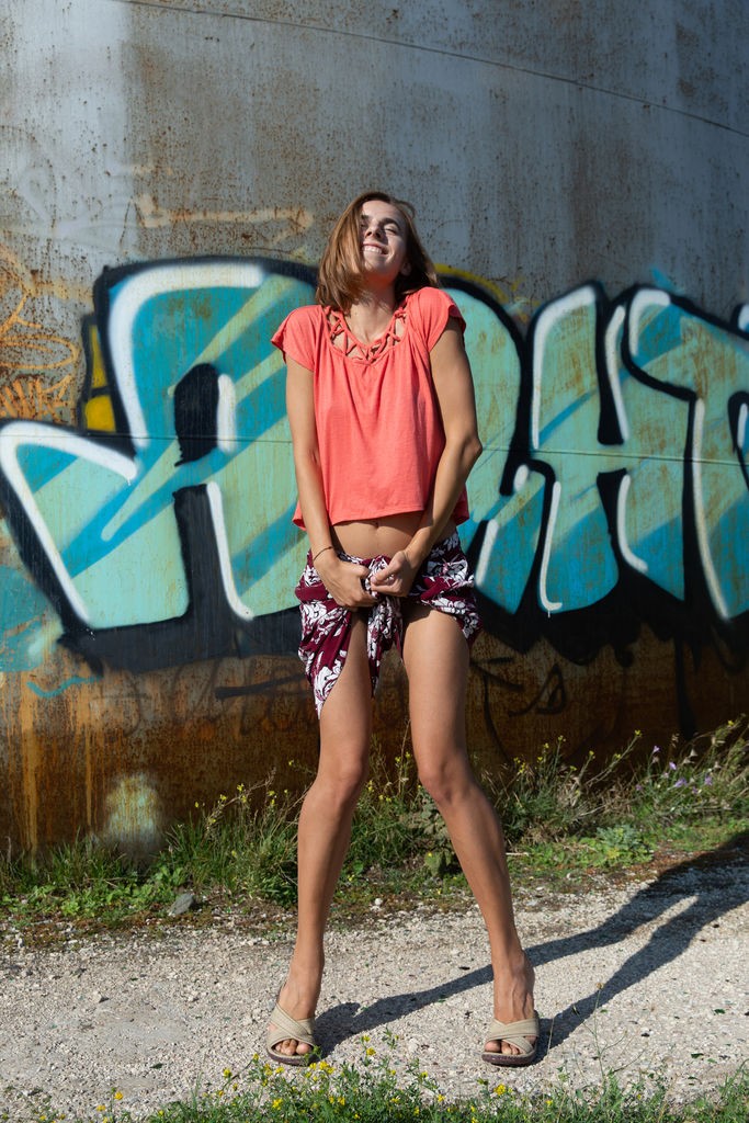 Gracie - Fun, skinny babe gets naked and climbs around outside