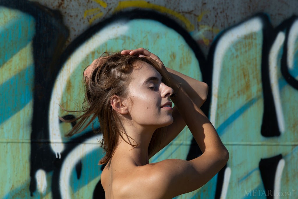 Gracie - Fun, skinny babe gets naked and climbs around outside