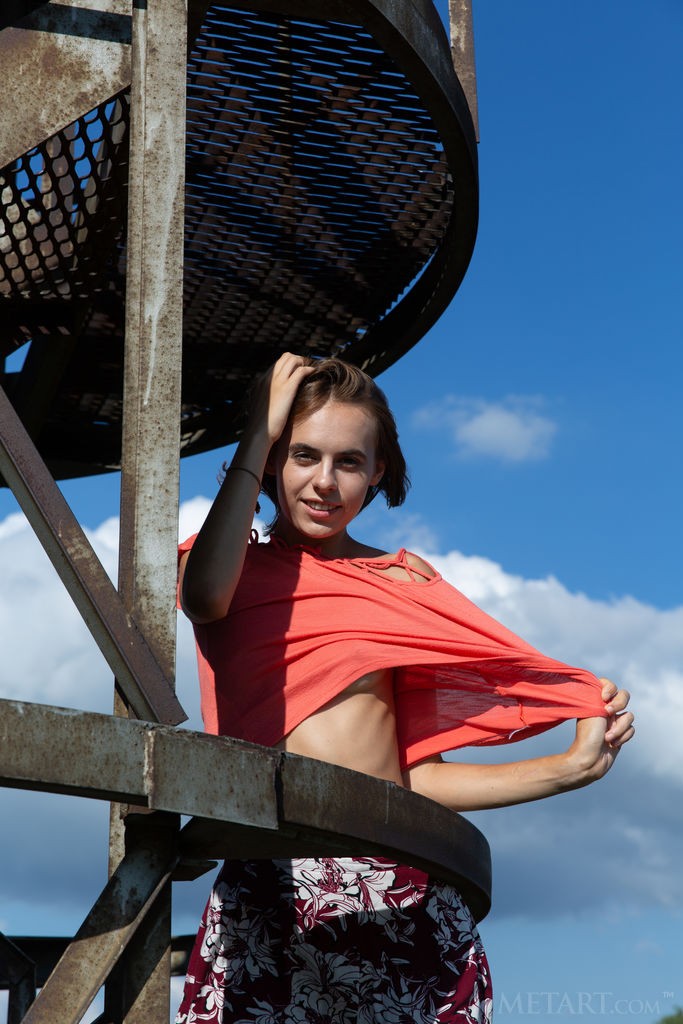 Gracie - Fun, skinny babe gets naked and climbs around outside