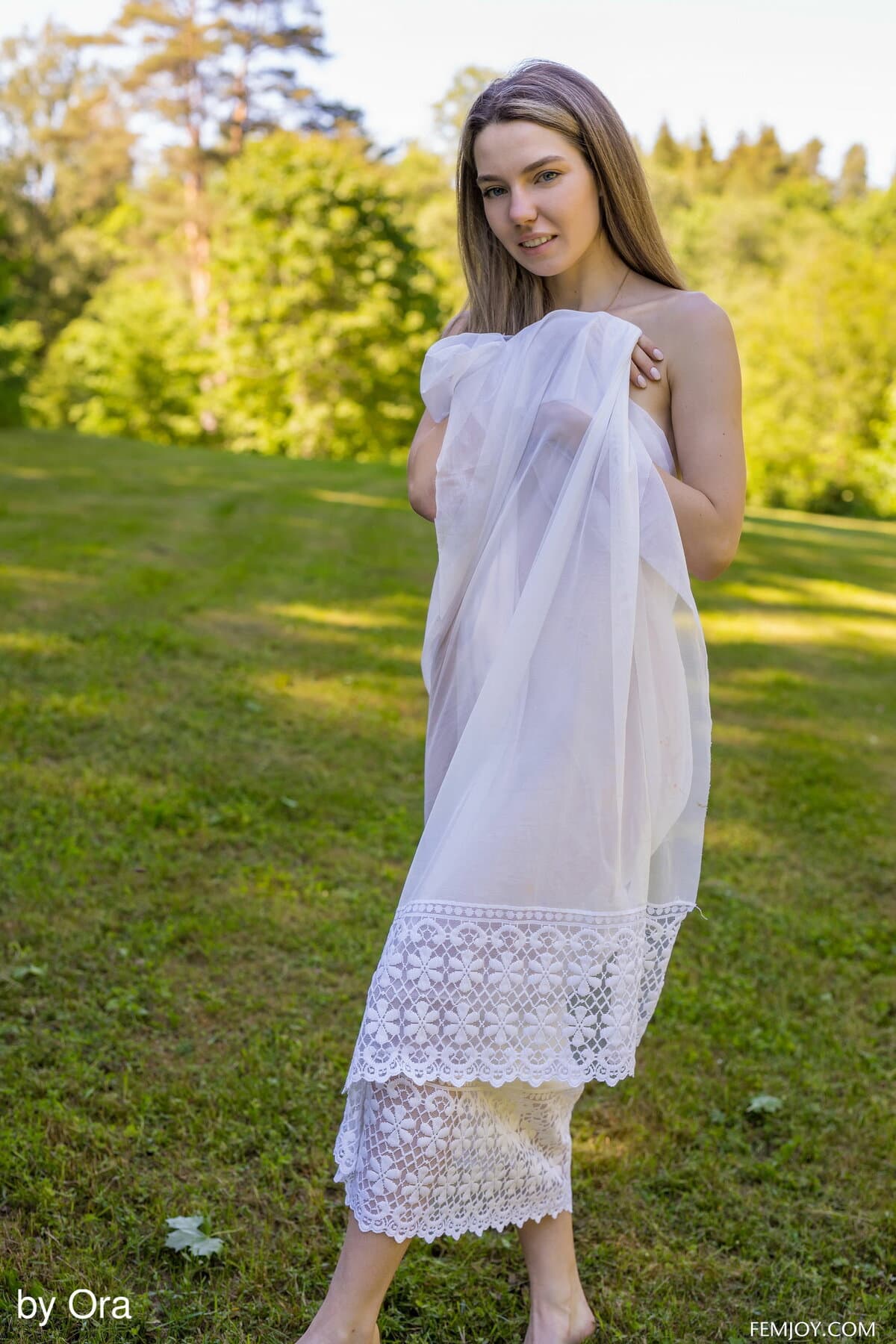 Stunning hot Kiere spreads and fingers her shaved pussy in the garden