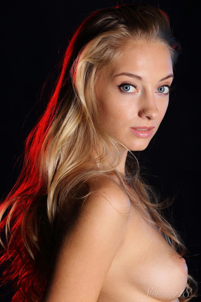 Blonde doll Ellison G exposing her natural curves for the camera
