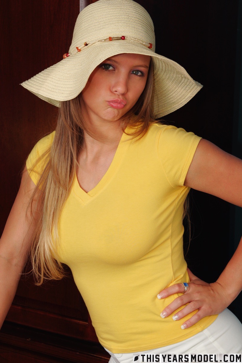 Dawson Miller slowly takes up a t-shirt flaunting her big boobs and bubble butt
