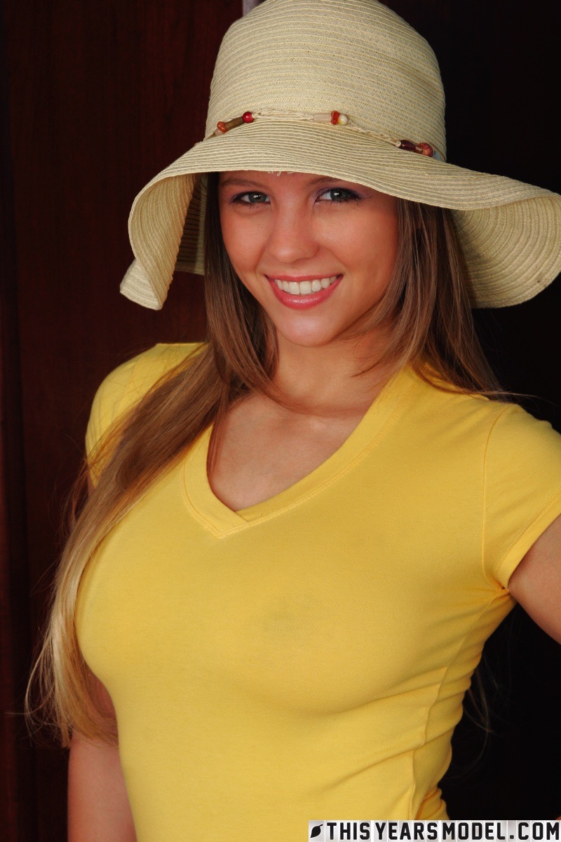 Dawson Miller slowly takes up a t-shirt flaunting her big boobs and bubble butt